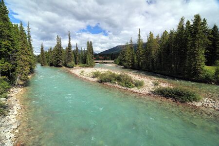 View On The Clear Bow River Near Lake Louise Villageの写真素材