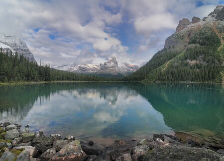 Reflections Of Mountains On The Calm Lake O'Hara Yoho National Parkの写真素材