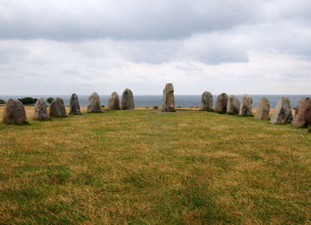 Ring Of Standing Stones Ales Stenar in Kaseberga graves On A Cloudy Summer Dayの写真素材