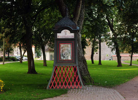 Ancient Swedish Telephone Booth In A Park In Vadstenaのeditorial素材