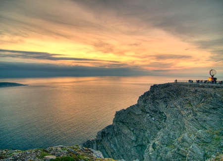 Sunset At North Cape In Norway On A Sunny Summer Day At Dusk With Only A Few Clouds In The Skyの写真素材