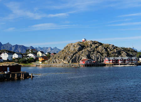 Waterfront Of The Small Fishing Village On Lofoten Island Skrova On A Sunny Summer Day With A Clear Blue Skyの写真素材