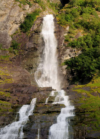 Water Splashing Down The Friaren Falls In The Geirangerfjord On A Sunny Summer Dayの写真素材