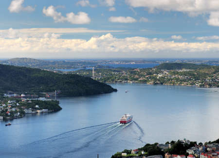 Spectacular View From Mount Floyen To The Byfjord And The Islands In Bergen On A Sunny Summer Day With A Clear Blue Sky And A Few Cloudsの写真素材
