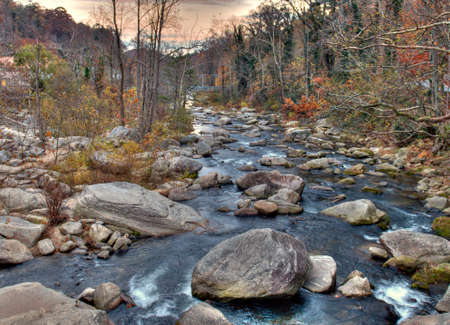 Large Boulders In The Picturesque Broad River During Indian Summer On A Sunny Autumn Day With A Clear Blue Sky And A Few Cloudsの写真素材