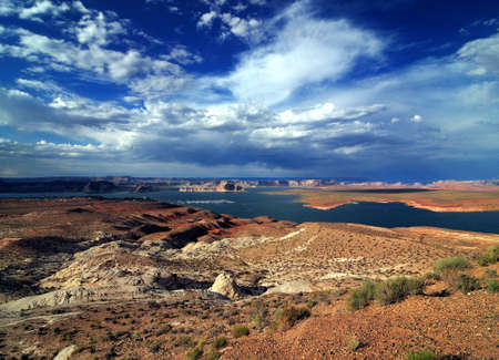 View To The Beautiful Lake Powell Arizona From The Scenic Overlook Viewpoint On A Hot Sunny Summer Day With A Thunderstorm Approachingの写真素材