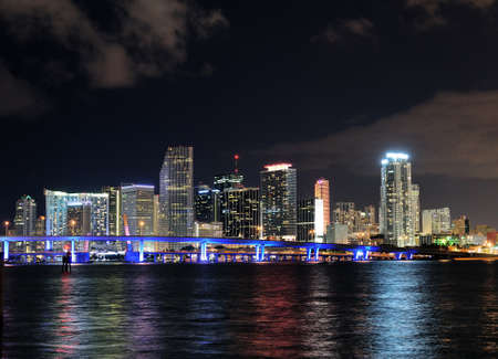 View To The Skyline Of Miami From Watson Island At Night On An Autumn Evening With A Clear Blue Sky And A Few Cloudsのeditorial素材