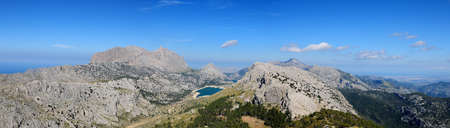 Spectacular Panorama View From The Summit Of Mount L'Ofre To The Puig Major And Lake Cuber In The Tramuntana Mountains On Balearic Island Mallorca On A Sunny Winter Day With A Clear Blue Skyの写真素材
