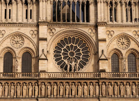 Beautiful Ornaments And The Rosette On The West Facade Of The Notre Dame Cathedral In Paris France On A Beautiful Spring Dayの写真素材