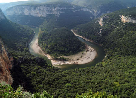 Aerial View Into The Canyon Of The Gorges De L'Ardeche With The Winding River Ardeche In France On A Beautiful Autumn Dayの写真素材
