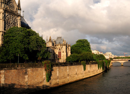 River Seine At The Notre Dame Cathedral In Paris France On A Beautiful Spring Day With Some Clouds In The Skyの写真素材