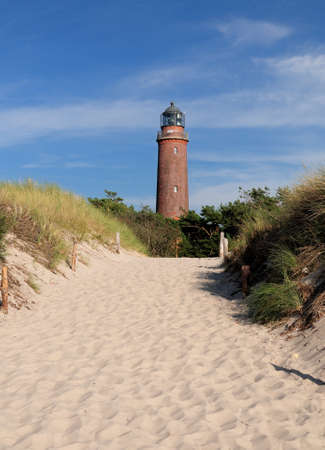 View From The Beach To The Lighthouse Darsser Ort Germany On A Beautiful Sunny Summer Day With A Clear Blue Sky And A Few Cloudsの写真素材