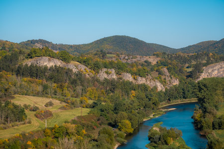 a body of water with a mountain in the backgroundの写真素材