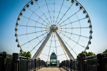 Big ferris wheel with a blue background with a deckのeditorial素材