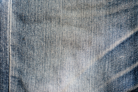 Old grunge vintage blue denim jeans texture.の写真素材