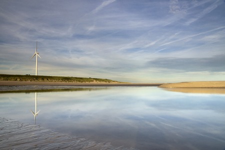 Windmill on the Maasvlakte beach near the port of Rotterdamの写真素材