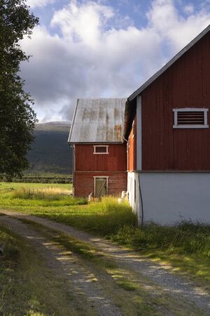 Falured painted farmbuilding near Lesja in the Norwegian region Gudbrandsdalenの写真素材