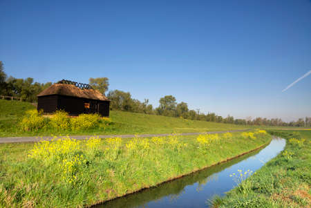 Ditch in a meadow near Hankの写真素材