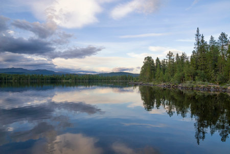 Evening mood at lake Funasdalssjon close to the Swedish village Funasdalenの写真素材