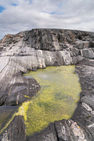 Small pond in rockの写真素材