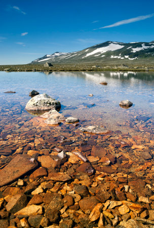 Rocks in lake Sjodalsvatnetの写真素材
