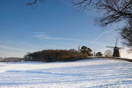 Windmill in a snowcovered landscape near Ubachsbergの写真素材