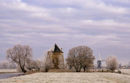 Ruins of a windmill surrounded by trees near Bleskensgraafの写真素材