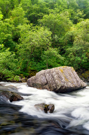Large rock in the Stalheimselvi river near Stalheimの写真素材