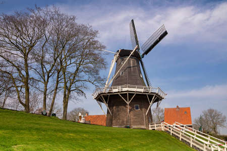 De Meeuw is a windmill on the bank of the Reitdiep river in the Dutch village Garnwerd in the province of Groningenの写真素材