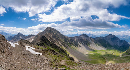 View from the Parpaner Rothorn to the surrounding mountain peaks near Lenzerheide in the Swiss canton Graubundenの写真素材