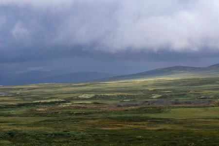 Bad weather above a mountain landscape between Torpo and Hemsedal in Norwayの写真素材