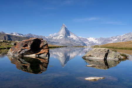 View at the Matterhorn from the Stellisee above the Swiss village Zermattの写真素材