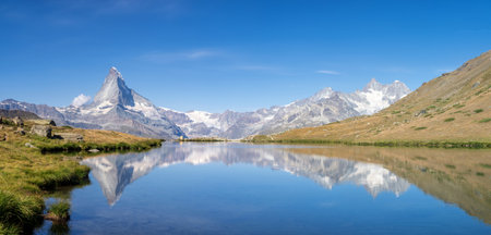 View from lake Stellisee near Zermatt on the Matterhorn, Dent Blanche, Ober Gabelhorn and Wellenkuppe mountain peaksの写真素材
