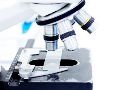 Close up Slide on Microscope in laboratory with copy space. laboratory and analytsis concept.