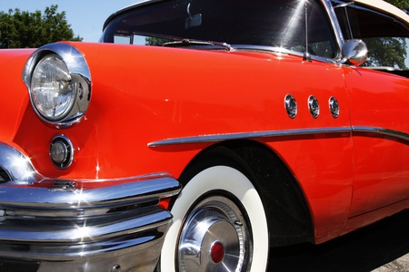 An old antique 1950 buick hot rod   Shiny orange, with lots of chrome   Great collectors car の写真素材