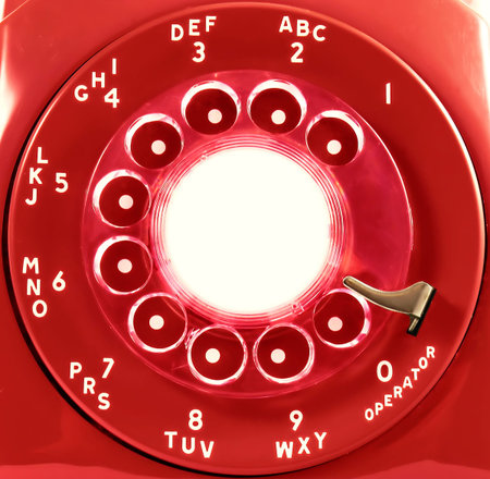 A rotary phone dial, in red   Room for copy on the center of the dialの写真素材