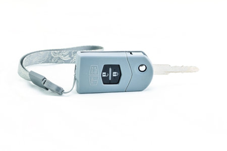 Car keys with protect package dirty on white background.