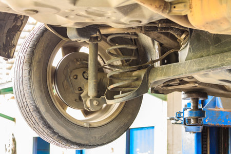 Detail shock absorber and spring of car.