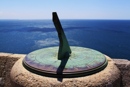 Sundial on St Michael s Mount with background of blue oceanの写真素材
