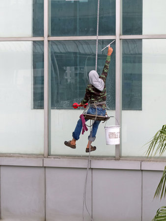 Cleaning windows service on a high building 