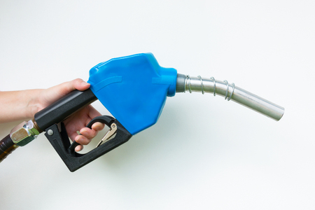 A fuel nozzle in hand on a white background.の写真素材