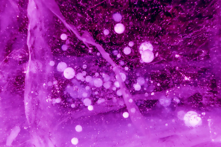 Abstract blurry background of violet outer space and white gravel and dust; created by filter effect program.の写真素材