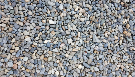 Background image of pebbles in various sizes and color; background and texture of gravels shoot by...