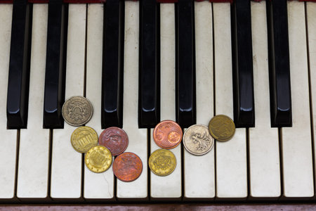 Old piano keys and coins