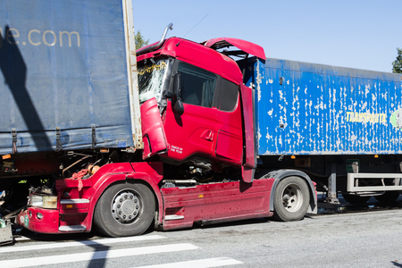 The collision of two trucks in Latvia, on the A8 road, occurred on August 23, 2018.The truck driver Iveco saw people on the pedestrian crossing and braked sharply, behind the driver who was driving Scania did not observe the distance and ran into Iveco. bのeditorial素材