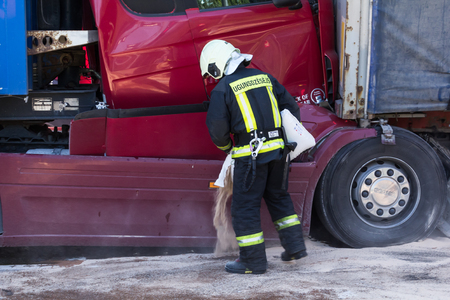 The collision of two trucks in Latvia, on the A8 road, occurred on August 23, 2018.The truck driver Iveco saw people on the pedestrian crossing and braked sharply, behind the driver who was driving Scania did not observe the distance and ran into Iveco. bのeditorial素材