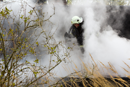 the work of firefighters in extinguishing the fire destroyed the village house 05.10.2018, in Mengele Latviaのeditorial素材