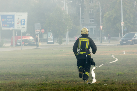 the work of firefighters in extinguishing the fire in factory RVR, 16.10.2018, in Riga, Latviaのeditorial素材