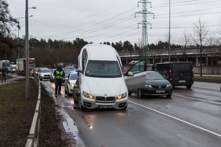 robber hijacked bmw x6 running away from the police in reverse pushed into the car hyundai, Riga, Latvia, 20th of February 2019のeditorial素材