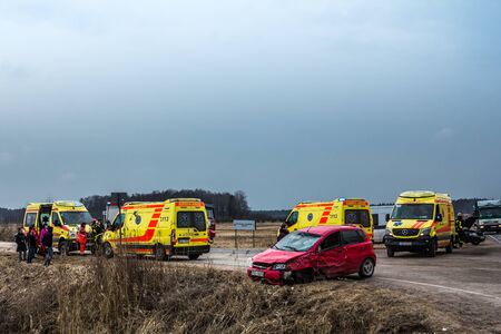 Car accident of three vehicles on A5 road in 4th of April 2018, cars after a collision with a heavy truck, in Latvia next to Kekava, transportation backgroundのeditorial素材